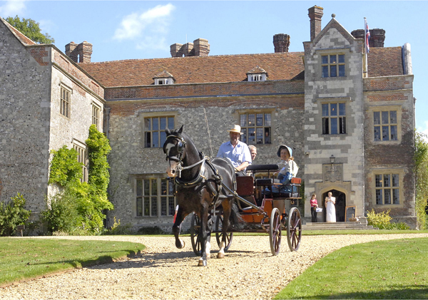 Open Day visitors enjoy a carriage ride from Chawton House to the village